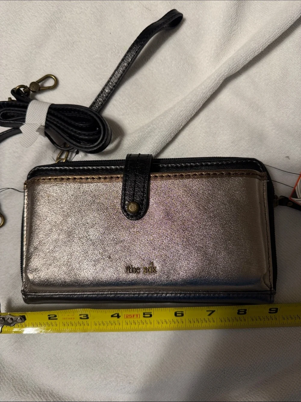 The Sak Metallic Rose Gold Wallet Crossbody with Black Trim